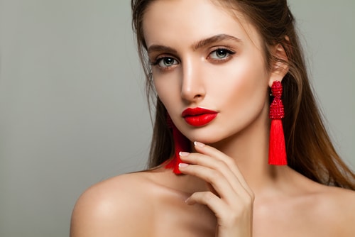 Young,Woman,With,Red,Lips,Makeup,And,Jewelry,Earrings.,Beautiful